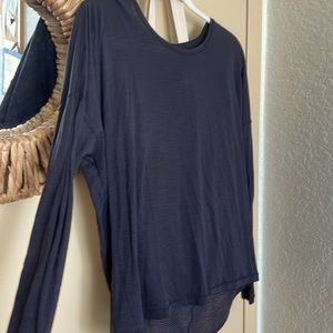 Long sleeve lulu lemon top with open back in perfect shape.
